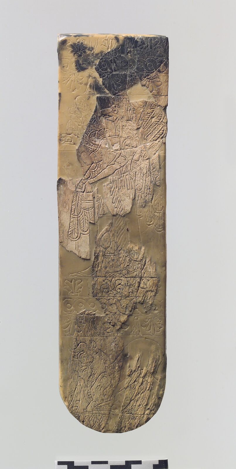 Assyrian plaque with winged bird-headed genie, 9th–8th century BCE