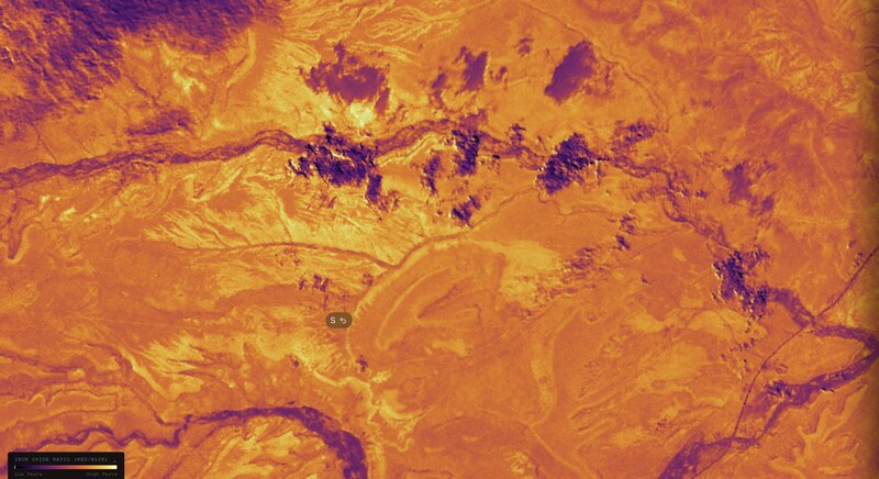 Earth Scanner — iron oxide ratio false-color satellite output
